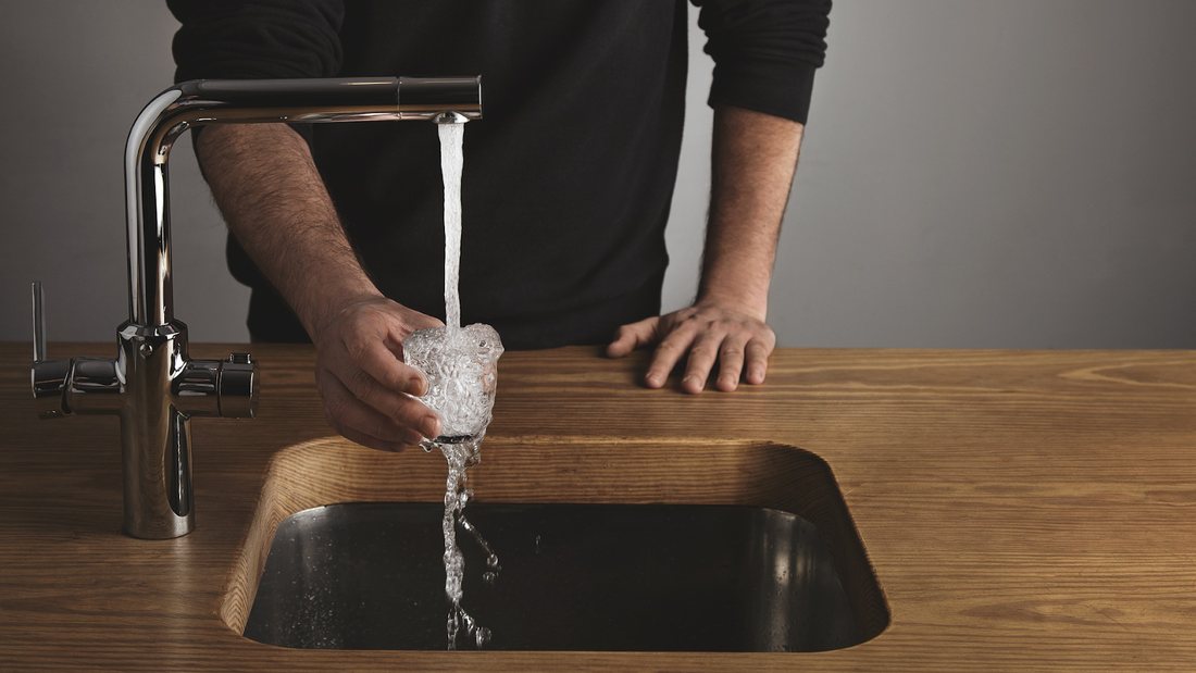 pouring water in glass